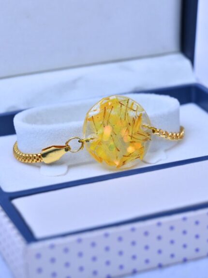 Resin Yellow Elegant Bracelet/ Rakhi With Gold Chain