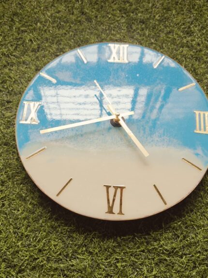 Ocean theme: “Ocean-themed resin wall clock with blue waves and white foam texture.”