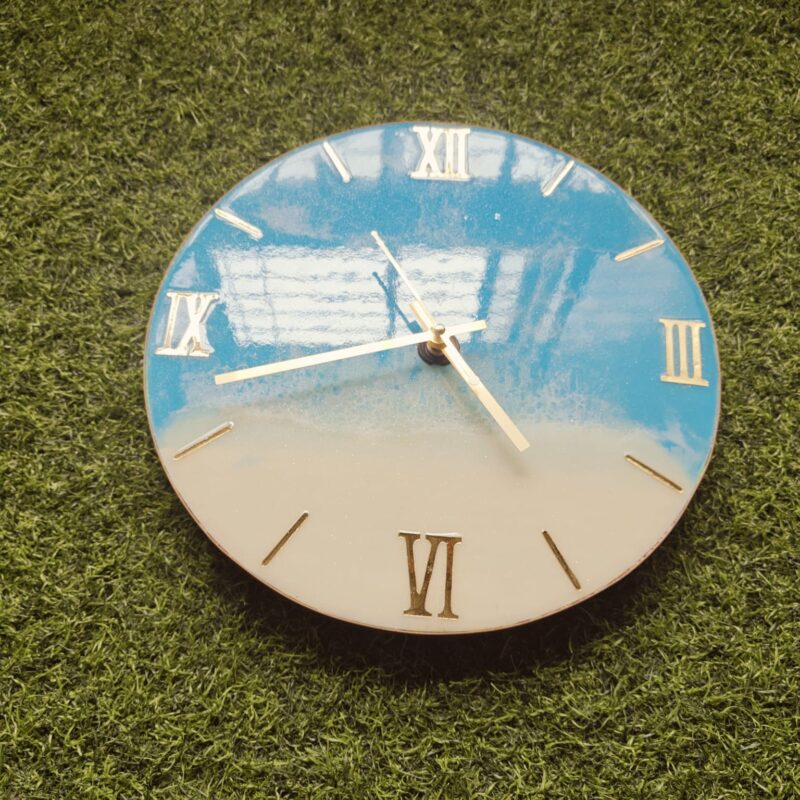 Ocean theme: “Ocean-themed resin wall clock with blue waves and white foam texture.”