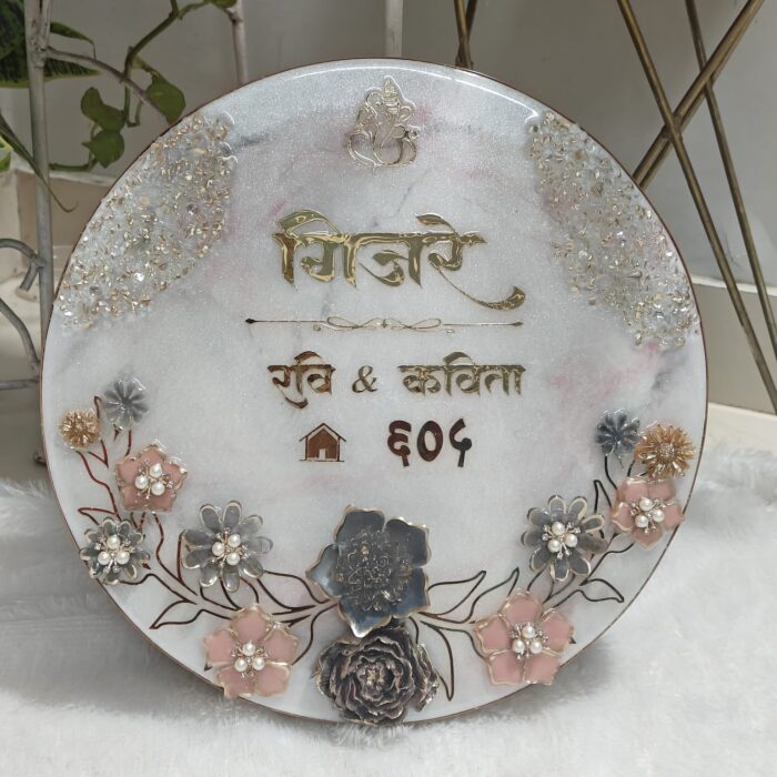 Handcrafted resin nameplate for home entrance – personalized with family name and floral design Custom epoxy resin nameplate with gold flakes and wooden base for house decor Elegant resin name board with marble texture and engraved couple names Personalized resin nameplate for main door with 3D flowers and metallic finish Unique handmade resin nameplate with modern calligraphy and glossy finish
