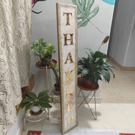 Handcrafted resin nameplate for home entrance – personalized with family name and floral design Custom epoxy resin nameplate with gold flakes and wooden base for house decor Elegant resin name board with marble texture and engraved couple names Personalized resin nameplate for main door with 3D flowers and metallic finish Unique handmade resin nameplate with modern calligraphy and glossy finish
