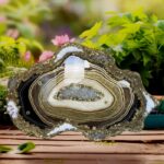 Add a touch of elegance and natural beauty to your space with this stunning geode resin wall art . Handcrafted with precision, this functional piece of art features swirling layers of epoxy resin in brown, shimmering gold, and pearlescent white, meticulously designed to mimic the intricate patterns of natural geodes. Accentuated with glittering glass crystals and metallic pigments, the wall piece face gleams with a luxurious finish, creating a captivating focal point for any room. Each piece is uniquely crafted, making it a truly one-of-a-kind addition to your home or office décor."https://saashi.co.in/wp-content/uploads/2024/09/Agate_epoxy_geode_wall_clock_31.jpg