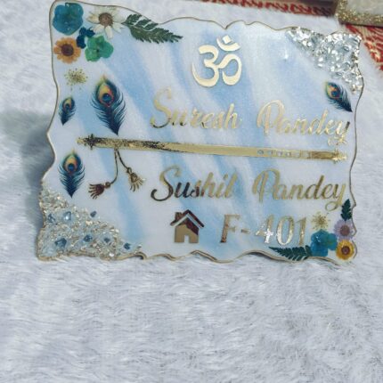 Handcrafted resin nameplate for home entrance – personalized with family name and floral design Custom epoxy resin nameplate with gold flakes and wooden base for house decor Elegant resin name board with marble texture and engraved couple names Personalized resin nameplate for main door with 3D flowers and metallic finish Unique handmade resin nameplate with modern calligraphy and glossy finish