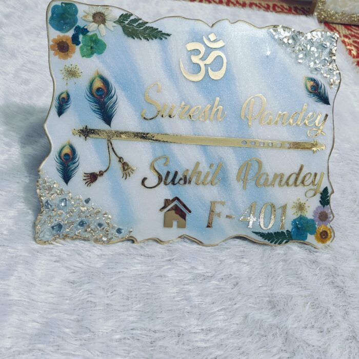 Handcrafted resin nameplate for home entrance – personalized with family name and floral design Custom epoxy resin nameplate with gold flakes and wooden base for house decor Elegant resin name board with marble texture and engraved couple names Personalized resin nameplate for main door with 3D flowers and metallic finish Unique handmade resin nameplate with modern calligraphy and glossy finish