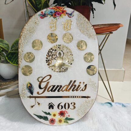 Handcrafted resin nameplate for home entrance – personalized with family name and floral design Custom epoxy resin nameplate with gold flakes and wooden base for house decor Elegant resin name board with marble texture and engraved couple names Personalized resin nameplate for main door with 3D flowers and metallic finish Unique handmade resin nameplate with modern calligraphy and glossy finish