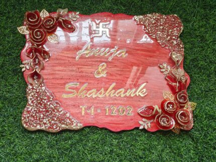 Handcrafted resin nameplate for home entrance – personalized with family name and floral design Custom epoxy resin nameplate with gold flakes and wooden base for house decor Elegant resin name board with marble texture and engraved couple names Personalized resin nameplate for main door with 3D flowers and metallic finish Unique handmade resin nameplate with modern calligraphy and glossy finish