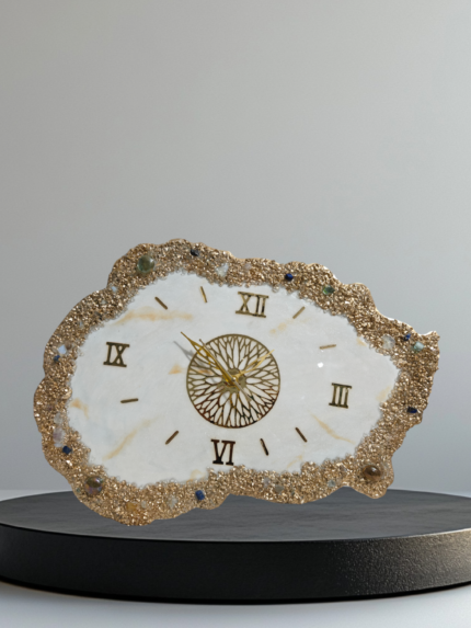 Alt Text: "White and gold crystal agate-shaped wall clock with intricate natural patterns, gold accents, and minimalist hands, offering a luxurious and modern décor accent."