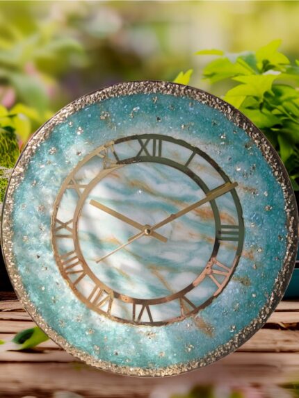 "Elegant marble-pattern geode wall clock with shimmering accents and gold-tone hands, blending artistic design with functionality."