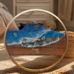 "Teakwood Ocean Resin Wall Clock with gold frame featuring handcrafted ocean-inspired resin art, perfect for modern and elegant décor."