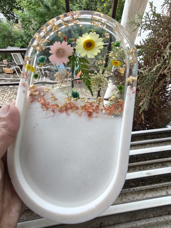 Handcrafted resin trinket tray with glossy finish, ideal for organizing jewelry, keys, and small accessories.