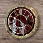 Handcrafted resin wall clock in vibrant red with glossy finish, perfect for modern home and office décor.