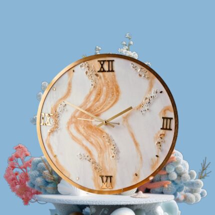 "Golden Sands resin wall clock with marble swirl design and gold Roman numerals"