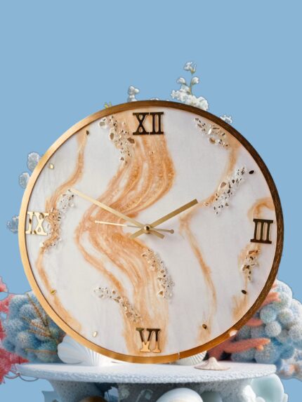 "Golden Sands resin wall clock with marble swirl design and gold Roman numerals"