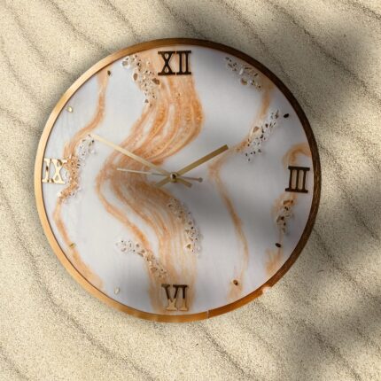 "Golden Sands resin wall clock with marble swirl design and gold Roman numerals"