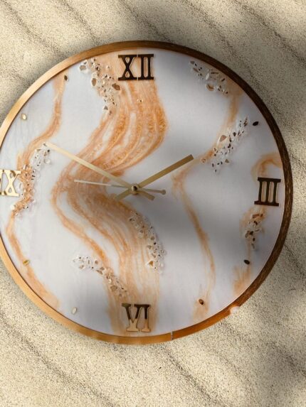 "Golden Sands resin wall clock with marble swirl design and gold Roman numerals"