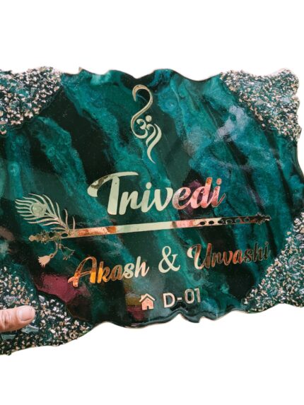 Luxury emerald green and teal marble resin nameplate with gold textured edges, featuring Om symbol, flute and feather design