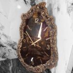 Luxury black and gold geode resin wall clock with crushed stone textured edges and metallic hour markers.