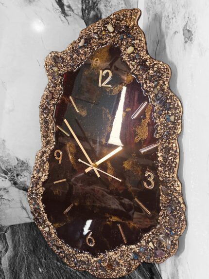 Luxury black and gold geode resin wall clock with crushed stone textured edges and metallic hour markers.